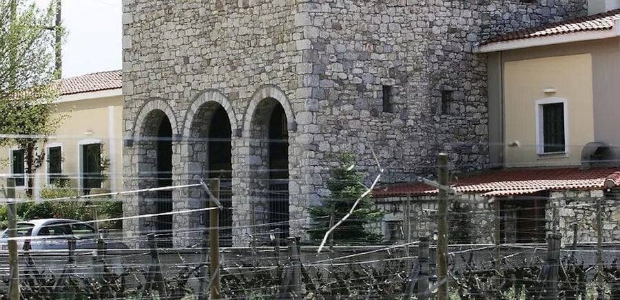 view of the base of Ktima Spiropoulos stone tower with two columns